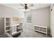 Cozy bedroom with a ceiling fan, a work station, and neutral decor at 3281 Pergusa Dr, Henderson, NV 89044