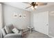 Charming bedroom featuring neutral colors, artwork, and a plush armchair at 3281 Pergusa Dr, Henderson, NV 89044