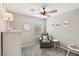 Inviting bedroom with a comfortable gray armchair, window, and carpet at 3281 Pergusa Dr, Henderson, NV 89044