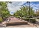 Community bocce ball court surrounded by benches, landscaping, and shaded areas at 3281 Pergusa Dr, Henderson, NV 89044