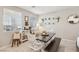 Bright dining area with tiled floor, table, chairs, and window view at 3281 Pergusa Dr, Henderson, NV 89044