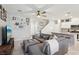 Spacious living room with a large sectional sofa, open floor plan, and recessed lighting at 3281 Pergusa Dr, Henderson, NV 89044