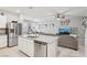 Open floor plan shows kitchen island flowing into dining and living areas at 3281 Pergusa Dr, Henderson, NV 89044