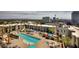 Stunning aerial view of a community pool surrounded by cabanas, lounge chairs, and well-maintained landscaping at 353 E Bonneville Ave # 369, Las Vegas, NV 89101