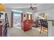 Inviting living room featuring a comfortable seating area and a sliding glass door for natural light at 3741 Round Robin St, North Las Vegas, NV 89032