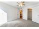 Bedroom featuring carpet, ceiling fan, closet, and neutral decor at 4406 Flowerdale Ct, Las Vegas, NV 89103