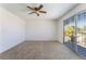 Bedroom featuring carpet, ceiling fan, and sliding glass door to a balcony at 4406 Flowerdale Ct, Las Vegas, NV 89103
