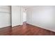 Cozy bedroom features wood floors, closet, and white walls at 4406 Flowerdale Ct, Las Vegas, NV 89103