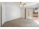 Bedroom with carpet, ceiling fan, and sliding doors leading to the outside at 4406 Flowerdale Ct, Las Vegas, NV 89103