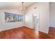 Dining room with chandelier, hardwood floors, and large window at 4406 Flowerdale Ct, Las Vegas, NV 89103