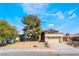 Charming single-Gathering home featuring a well-maintained front yard and attached two-car garage at 4406 Flowerdale Ct, Las Vegas, NV 89103
