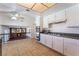 Bright kitchen with tiled floor, double oven, and white cabinets at 4406 Flowerdale Ct, Las Vegas, NV 89103
