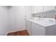 Convenient laundry room area with modern washer and dryer units and storage at 4406 Flowerdale Ct, Las Vegas, NV 89103
