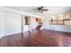 Open-concept living room boasts hardwood floors, ceiling fan, and adjacent bar area at 4406 Flowerdale Ct, Las Vegas, NV 89103