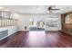 Spacious living room with hardwood floors, fireplace, and sliding glass doors to the pool area at 4406 Flowerdale Ct, Las Vegas, NV 89103