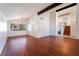 Open-concept living area with hardwood floors, vaulted ceilings, and plenty of natural light at 4406 Flowerdale Ct, Las Vegas, NV 89103