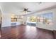 Bright living room with sliding doors, hardwood floors, and views of the pool at 4406 Flowerdale Ct, Las Vegas, NV 89103