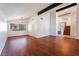 Bright living room boasts chandelier, hardwood floors, and staircase at 4406 Flowerdale Ct, Las Vegas, NV 89103