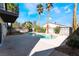 This is a backyard swimming pool and hot tub with landscaping at 4406 Flowerdale Ct, Las Vegas, NV 89103