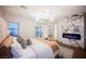 Modern bedroom with marble accent wall, fireplace, and patio access at 501 Proud Eagle Ln, Las Vegas, NV 89144