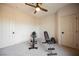 Home gym featuring exercise bike, weight bench, and natural light from the window, ideal for fitness routines at 501 Proud Eagle Ln, Las Vegas, NV 89144