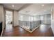 Open and airy loft area with hardwood floors, offering a versatile space for relaxation or entertainment at 501 Proud Eagle Ln, Las Vegas, NV 89144