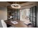 Bright and airy home office with custom built-ins and glass french doors leading to dining room at 501 Proud Eagle Ln, Las Vegas, NV 89144