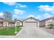 Charming single-story home features a well-maintained lawn, neutral tones, and a two-car garage at 5988 Turtle River Ave, Las Vegas, NV 89156