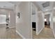 Hallway featuring tile floors, neutral walls, leading to the bathroom, laundry, and other living spaces at 5988 Turtle River Ave, Las Vegas, NV 89156