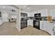 Bright kitchen showcasing stainless steel appliances, white cabinets, and stylish countertops, creating a modern culinary space at 5988 Turtle River Ave, Las Vegas, NV 89156