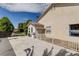 Exterior view with a partially shaded patio, fenced area, and lush landscaping at 6513 Echo Crest Ave, Las Vegas, NV 89130