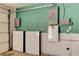 Garage featuring two Tesla Powerwall units, enhancing energy efficiency at 6513 Echo Crest Ave, Las Vegas, NV 89130