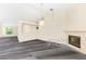 Open living room featuring fireplace, stairs and neutral wall color at 6513 Echo Crest Ave, Las Vegas, NV 89130