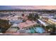 A luxurious home with a pool, tennis court, putting green, covered patio and other unique amenities at 6975 Darby Ave, Las Vegas, NV 89117
