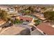 Expansive property featuring a pool, tennis court, modern landscaping, and ample parking in a serene neighborhood setting at 6975 Darby Ave, Las Vegas, NV 89117