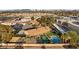 Backyard oasis featuring a pool, tennis court, putting green, and ample outdoor lounging at 6975 Darby Ave, Las Vegas, NV 89117