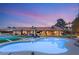 Outdoor oasis featuring a sparkling pool, spa, and lounge seating perfect for relaxation at 6975 Darby Ave, Las Vegas, NV 89117