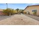 Spacious backyard with low-maintenance landscaping, providing a blank canvas for creating your dream outdoor space at 6975 Darby Ave, Las Vegas, NV 89117