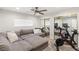 Versatile bedroom featuring plush sofa, mirrored closet doors, and an exercise bike at 6975 Darby Ave, Las Vegas, NV 89117