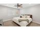 Cozy bedroom with a comfortable bed, soft pillows, a throw blanket, and ample natural light at 6975 Darby Ave, Las Vegas, NV 89117