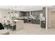Modern kitchen with grey cabinetry, stainless steel appliances, and a spacious center island with seating at 6975 Darby Ave, Las Vegas, NV 89117