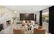 Bright living room featuring a marble fireplace, modern furniture, and stylish decor at 6975 Darby Ave, Las Vegas, NV 89117