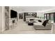 Spacious living room features a stylish fireplace, large sectional sofa, and a built-in bar area at 6975 Darby Ave, Las Vegas, NV 89117
