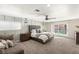 Spacious main bedroom with a ceiling fan, a comfortable bed, and sliding glass doors to the backyard at 6975 Darby Ave, Las Vegas, NV 89117