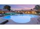 Backyard featuring pool, spa, sport court and an array of desert landscaping at 6975 Darby Ave, Las Vegas, NV 89117