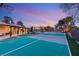 Full view of sport court, covered patio and lush lawn at 6975 Darby Ave, Las Vegas, NV 89117