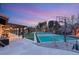 Backyard with a sport court for basketball and pickleball along with covered patio space at 6975 Darby Ave, Las Vegas, NV 89117