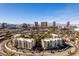 Stunning aerial view of condos, landscaping, and the Las Vegas strip skyline on a clear day at 730 S Royal Crest Cir # 426, Las Vegas, NV 89169