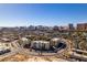 Scenic aerial view of buildings with palm trees and the Las Vegas cityscape in the distance at 730 S Royal Crest Cir # 426, Las Vegas, NV 89169