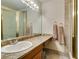 Bathroom with granite countertop, sink, and shower with gold trim; neutral paint and tile at 730 S Royal Crest Cir # 426, Las Vegas, NV 89169